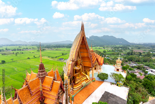 Wat Tham Sua temple at Kanchanaburi province Thailand. Large pagoda and Buddha statue. Beautiful a bigest Buddha statue and it is a major tourist attraction of Thailand. photo