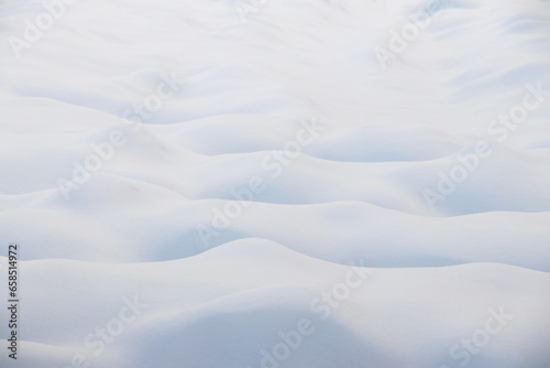 Snow texture, snow-covered field with uneven surface