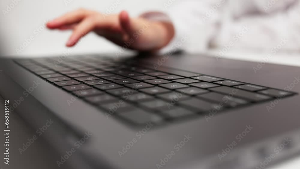 Child schoolgirl girl typing keyboard using laptop with touch screen, online course of educational lessons at home. Distance learning course, remote video conference. Schoolgirl studying at school Child schoolgirl girl typing keyboard using laptop with touch screen, online course of educational lessons at home. Distance learning course, remote video conference. Schoolgirl studying at school