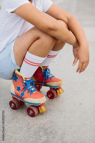 Close-up of legs in roller skates.