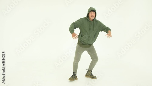 Asian man dancing on white background