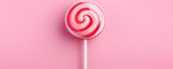 Sweet tasty pink lollipop on a pink background. Generative AI.