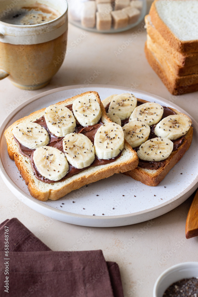 Sandwich with chocolate paste, banana and chia seeds. Breakfast. Vegetarian food. Sandwich with chocolate paste, banana and chia seeds. Breakfast. Vegetarian food.