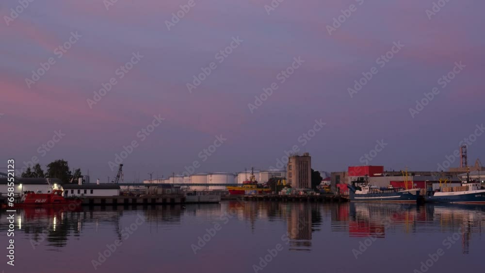 Panorama of a harbor on a calm and peaceful evening with fishing ships Panorama of a harbor on a calm and peaceful evening with fishing ships