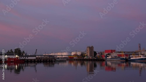 Panorama of a harbor on a calm and peaceful evening with fishing ships