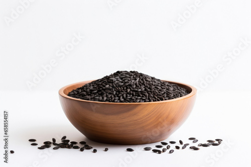 black wheat in wooden bowl on white background