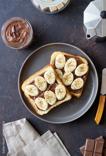 Sandwich with chocolate paste, banana and chia seeds. Breakfast. Vegetarian food.