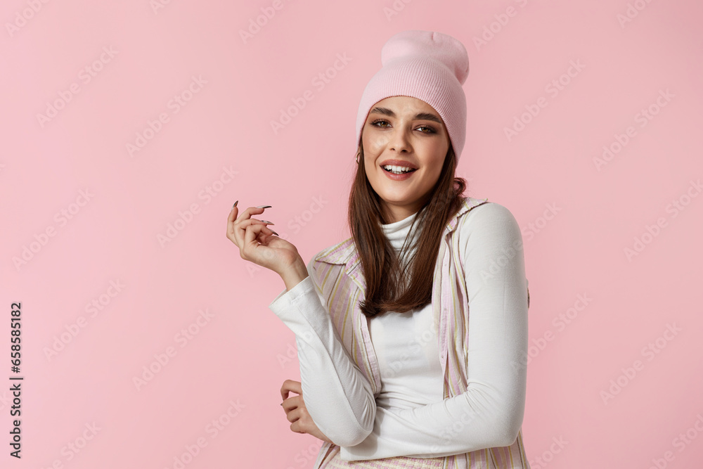 Happy playful young woman in pink hat, shirt and skirt Happy playful young woman in pink hat, shirt and skirt