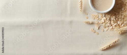 Uncooked oats on the isolated pastel background Copy space Nourishing sustenance photo