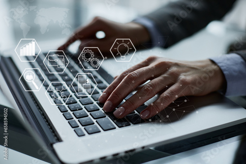 Close-up of male hands using laptop at office