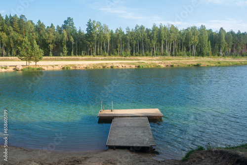 blue water in a Dubkalnu Reservoir at Zilie Kalni (Blue Hills) Nature Park in the Ogre municipality, Latvia. photo