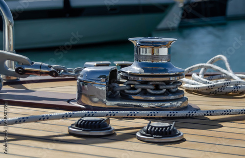 Vertical electric anchor winch on the on the teak deck.