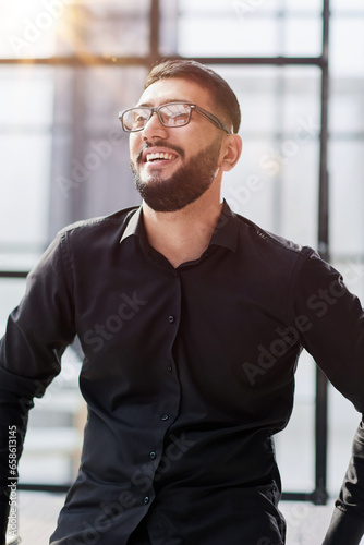 portrait of a young businessman who is smiling © Katsiaryna