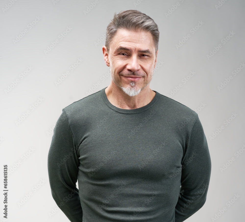 Portrait of happy casual older man smiling, Mid adult, mature age guy standing, isolated on gray background. Portrait of happy casual older man smiling, Mid adult, mature age guy standing, isolated on gray background.