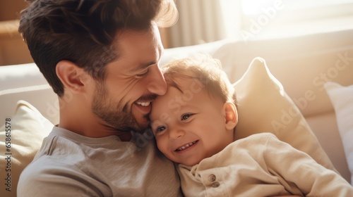 Father sleeping with baby on the bed 