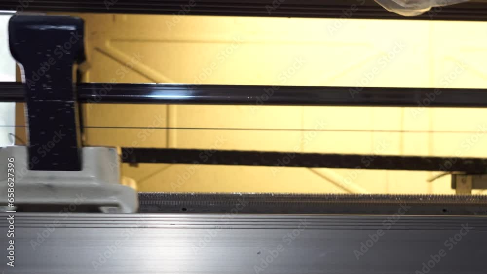 Textile looms are in the process of weaving cloth Textile looms are in the process of weaving cloth