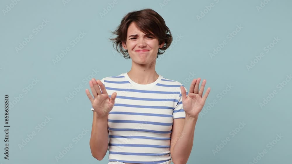 Young woman wear striped t-shirt casual clothes look camera pointing fingers herself ask say who me no thanks i do not need it isolated on pastel plain light blue cyan background. Lifestyle concept Young woman wear striped t-shirt casual clothes look camera pointing fingers herself ask say who me no thanks i do not need it isolated on pastel plain light blue cyan background. Lifestyle concept