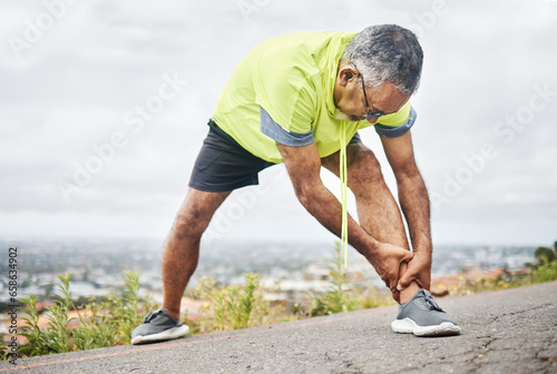 Mature  man and stretch from exercise by road for recovery  wellness or joint pain for better health. Elderly person  fitness or workout for strength  power or cardio for rehabilitation in retirement