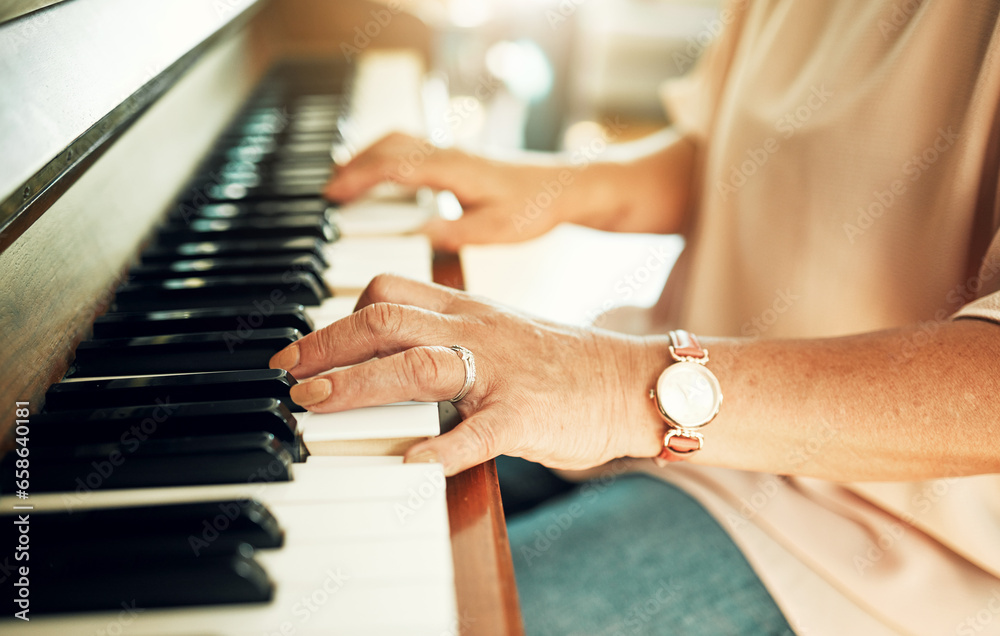 Fototapeta premium Hands, closeup and woman playing piano for music in living room for musical talent practice. Instrument, song and zoom of senior female person in retirement enjoying keyboard at modern home.