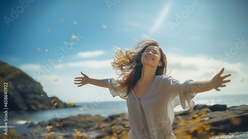 woman with arms outstretched on beach