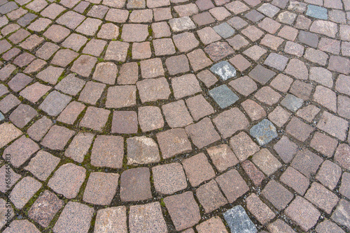 Stoned pavement with a circular pattern.