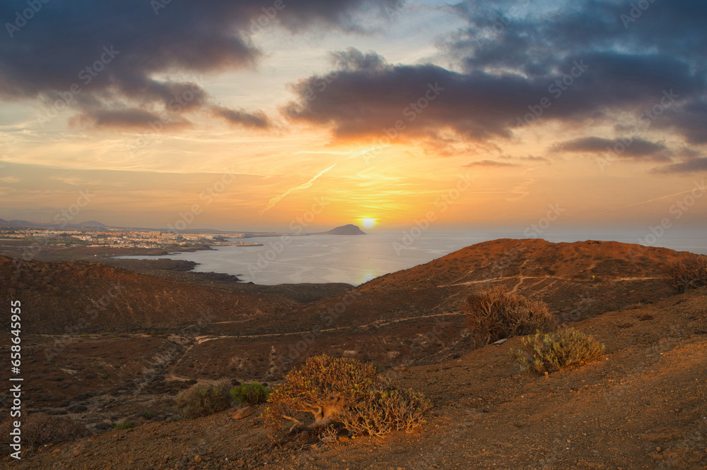 Spectacular sunrise from Yellow Mountain (Montaña Amarilla) in Tenerife. In the background El Médano