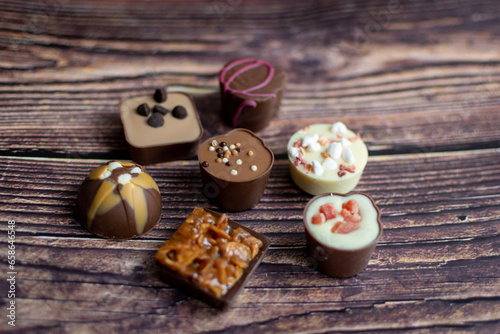 luxury chocolate candies on a wooden background 