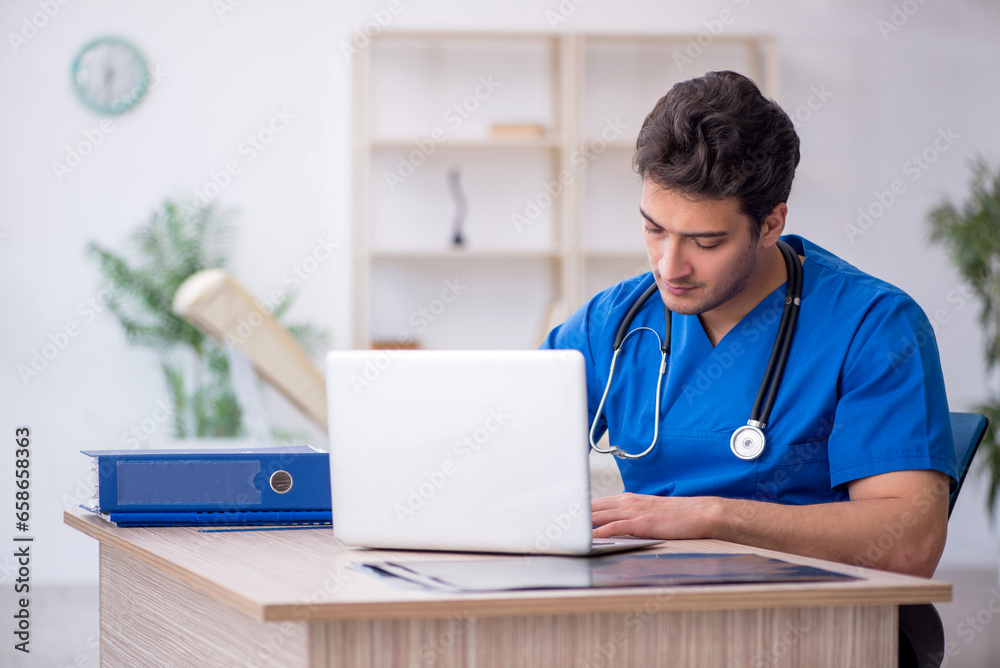 Young male doctor in telemedicine concept