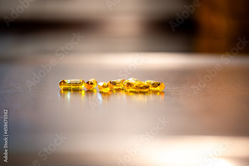 Multiple capsules with coenzyme Q10 coq10 on a kitchen counter
