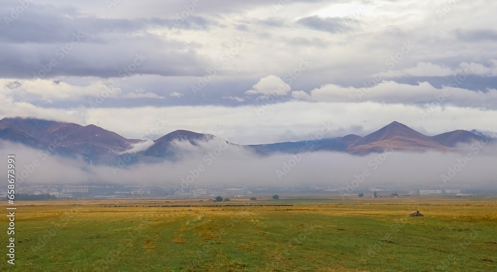 An autumn morning in Erzurum. The layer of fog covering the city offers a beautiful view.