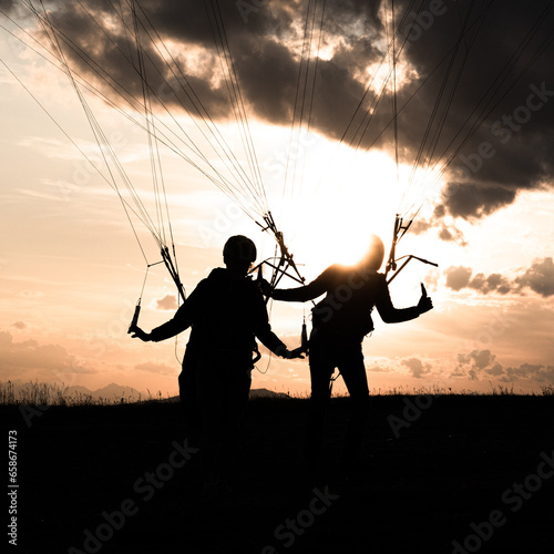 silhouette of a person paraglider