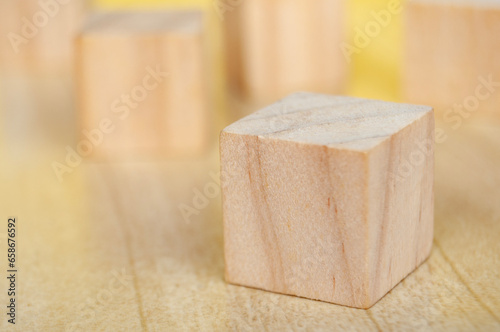 Closeup of blank wooden cubes with customizable space for text or ideas. Copy space