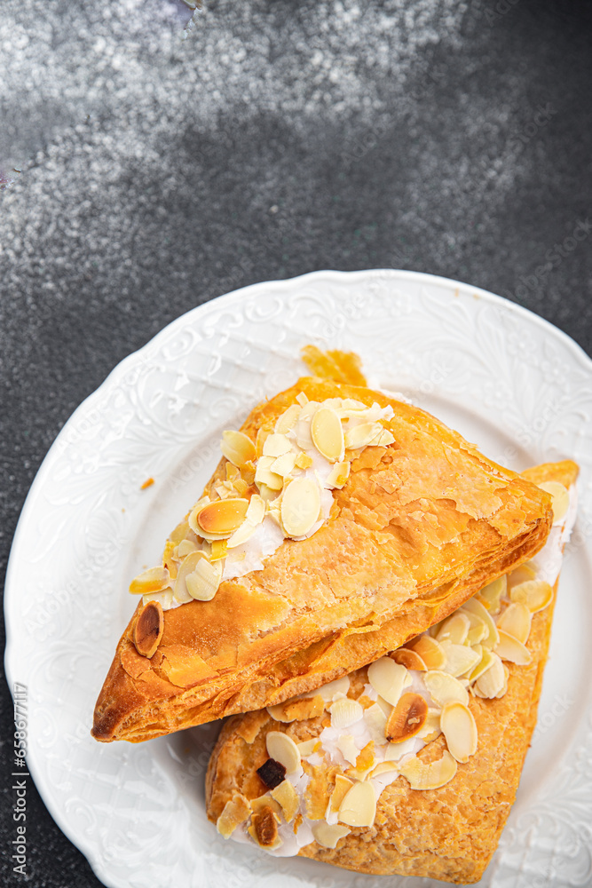 almond triangle cake cream puff pastry sweet dessert delicious healthy eating cooking appetizer meal food snack on the table copy space
