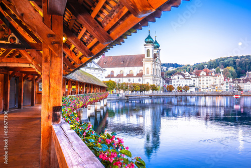 Chappel bridge historic wooden landmark in Luzern and town riverfront view