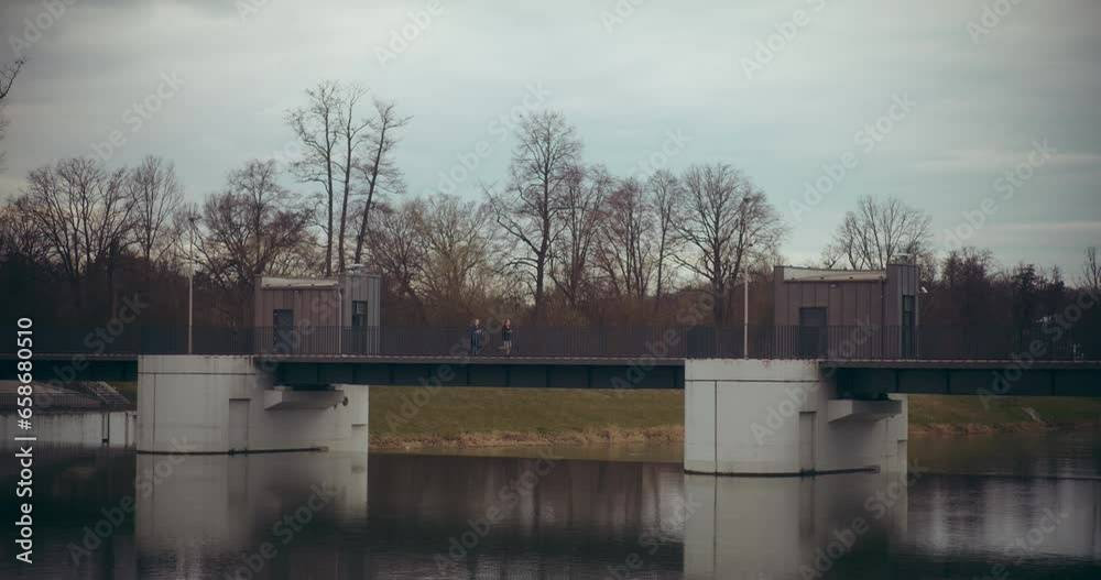 Sportswomen running on bridge in garden
