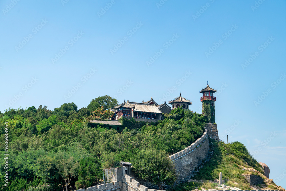 The ancient city walls at sea and the watchtower on the mountain, the Penglai Pavilion in Yantai