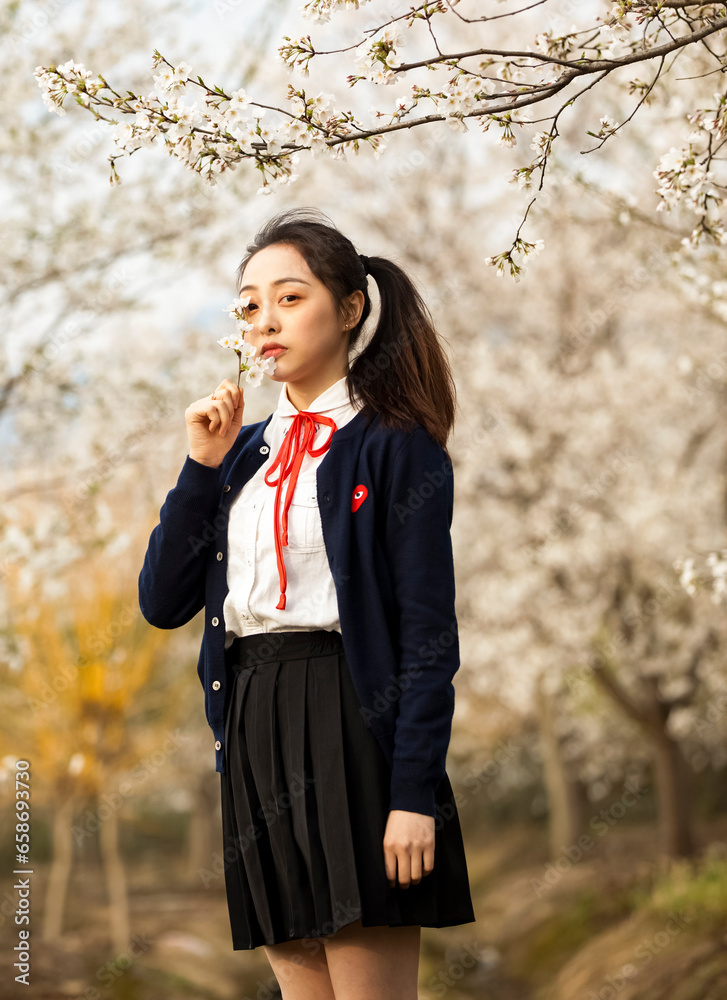 Asian girl playing under the plum tree Asian girl playing under the plum tree