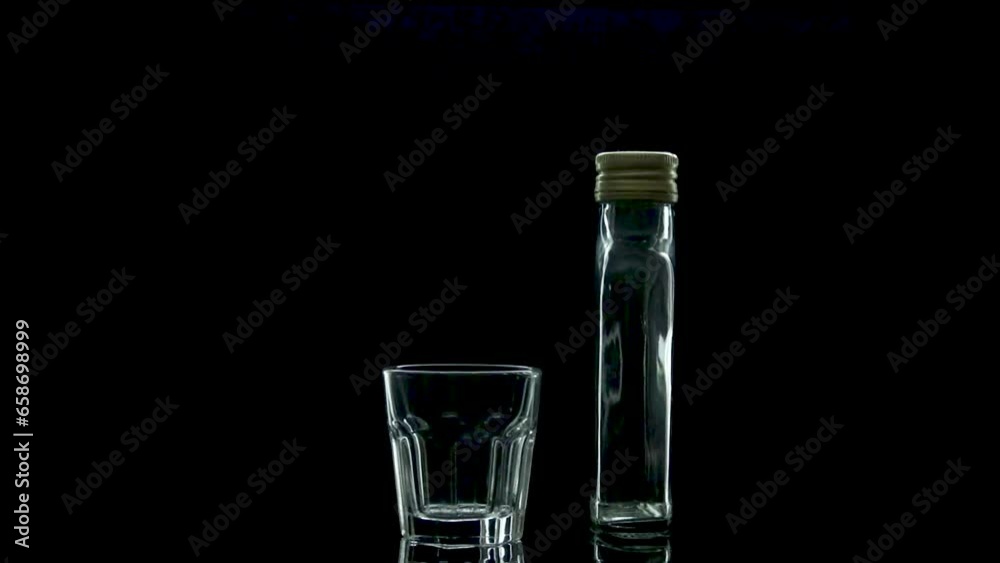 glass bottle and shallow glass rotate in the dark in contour light glass bottle and shallow glass rotate in the dark in contour light