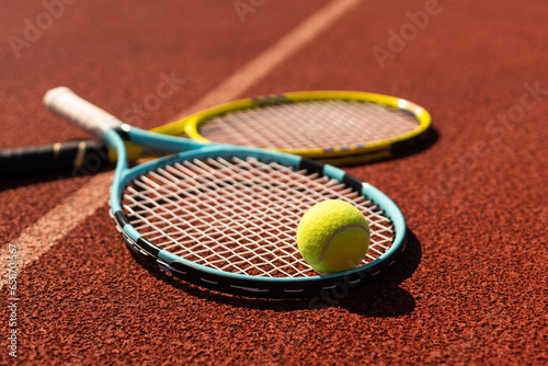 Tennis scene with balls, racquets and hard court surface corner lines © Angelov