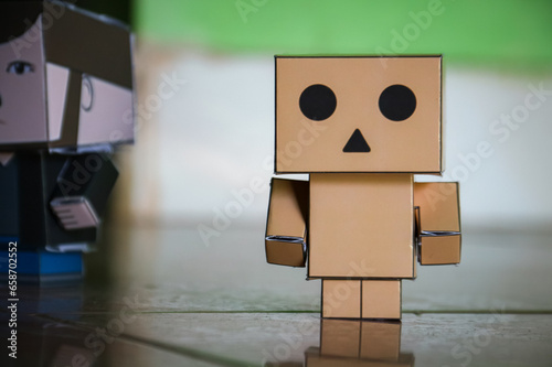Conceptual image of a man made of cardboard box with face