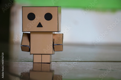 Conceptual image of a man made of cardboard box with face