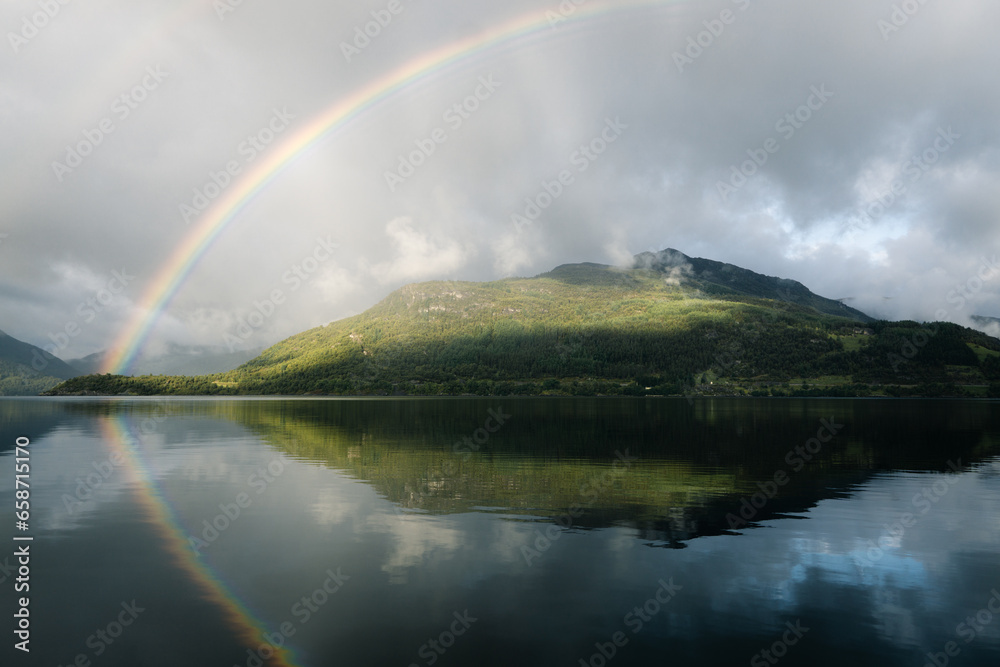 Rainbow over the fjord in Norway Rainbow over the fjord in Norway