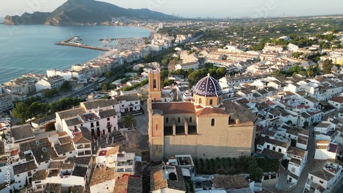 Flying 180 degrees around Church of Our Lady of Consolation, with mediterranean sea in background, Altea in Spain.  Catholic Church in Costa Blanca,Spain.