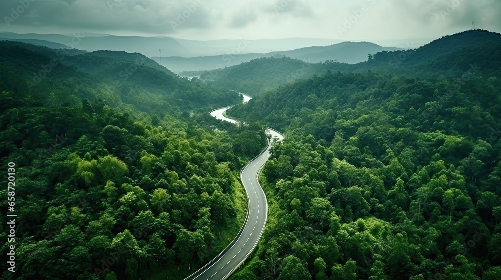Aerial top view beautiful curve road on green forest in the rain season. - obrazy, fototapety, plakaty 