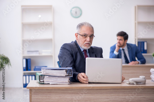 Two male colleagues working in the office