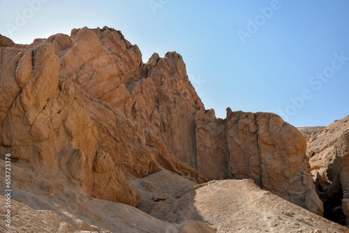 View of the mountain of natural sandstone against the blue clear sky. Desert landscape, Egypt, Africa. Copy space. Selective focus. © Marina_Nov