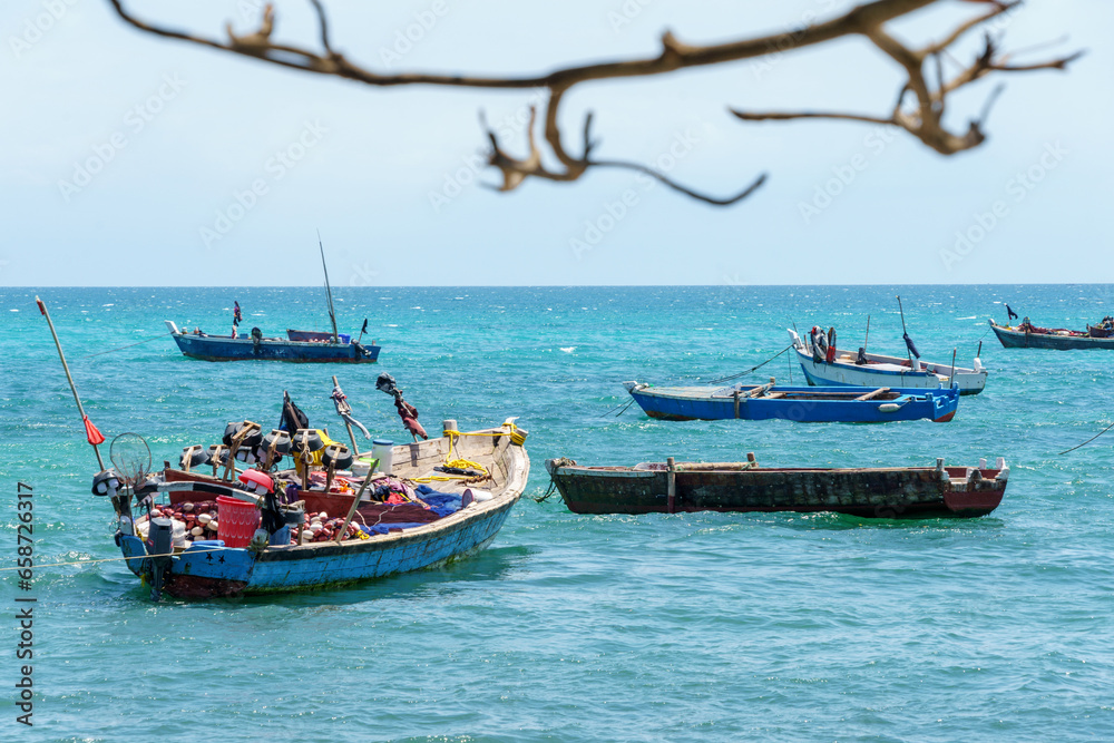 Fototapeta premium traditional dhow fishing boats moored at high tide