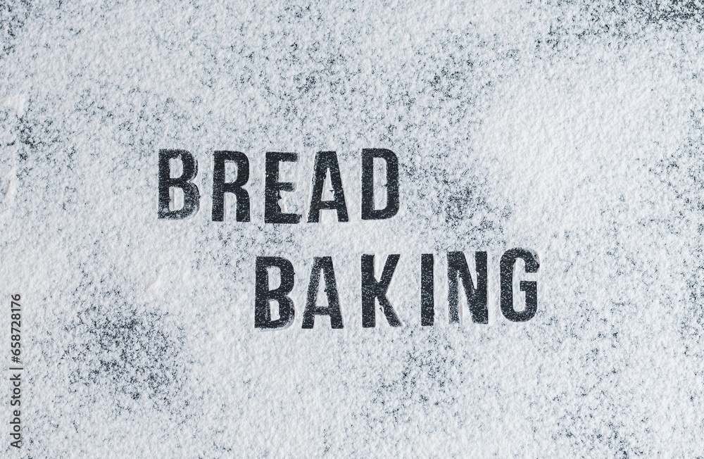 The inscription on the flour: baking bread on a black stone table. The inscription on the flour: baking bread on a black stone table.