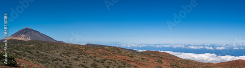 A panoramic of Mount Tiede, Tenerfie. The highest point in Spain. Clouds can be seen gathering on the coastline below the volcanic peak