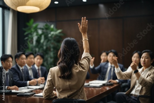 Businesswoman in front of a group of people in the conference room © Viewvie